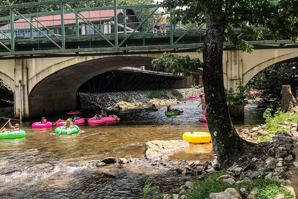 GA-mountains bright colored tubing going down the Chattahoochee River. weekend getaway to Cleveland and Helen GA